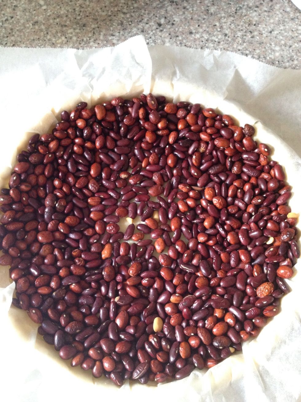 I'm using dry beans. I use the same beans every time and keep them in a special tin. Make sure they are all around the edge and up the sides.