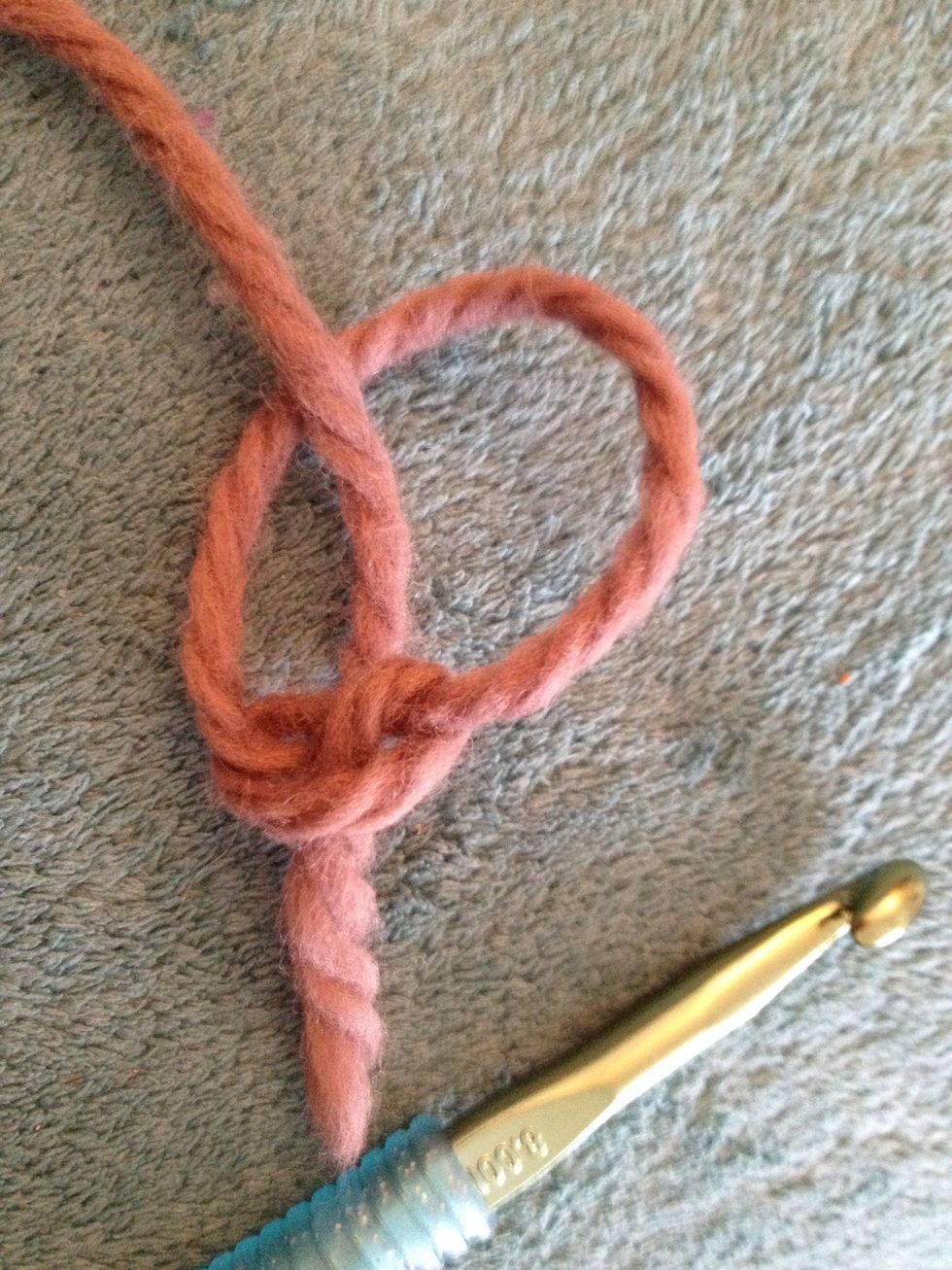 I'm using light yarn so hopefully you can see better! Start out with a slipknot like so.