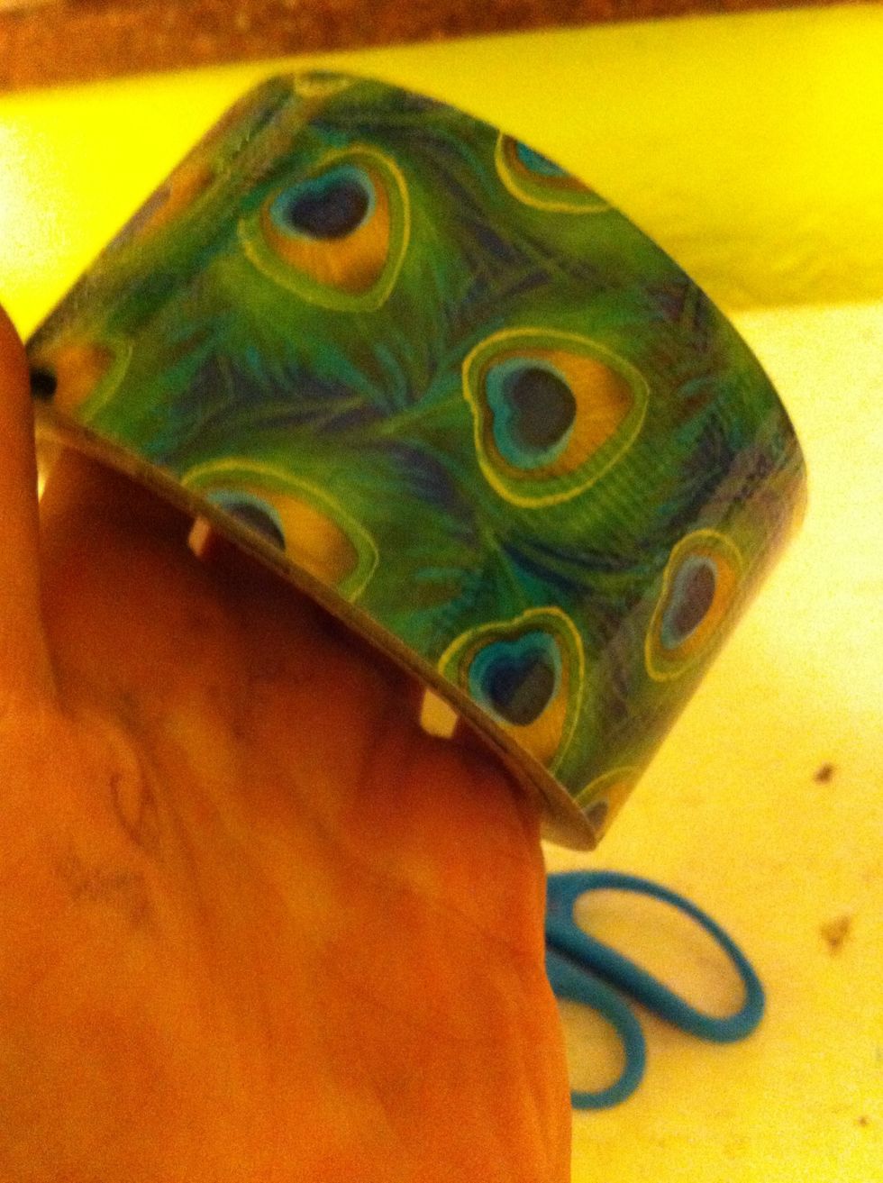 I'm using my peacock feather Duck tape because it's one of my new rolls