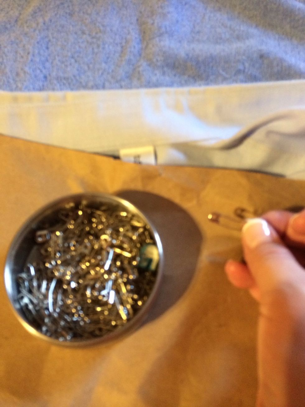 I'm using safety pins to hold it in place. You could also use straight pins, clothes pins or clips.