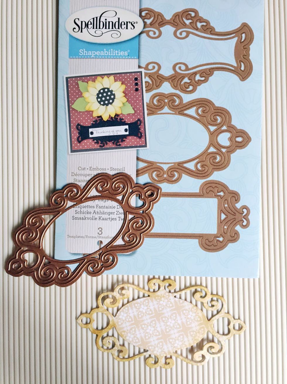 I'm using Spellbinders Shapeabilities to die-cut an oval ornate frame using the Apple Pie pattern paper. Distress the edges if desired.