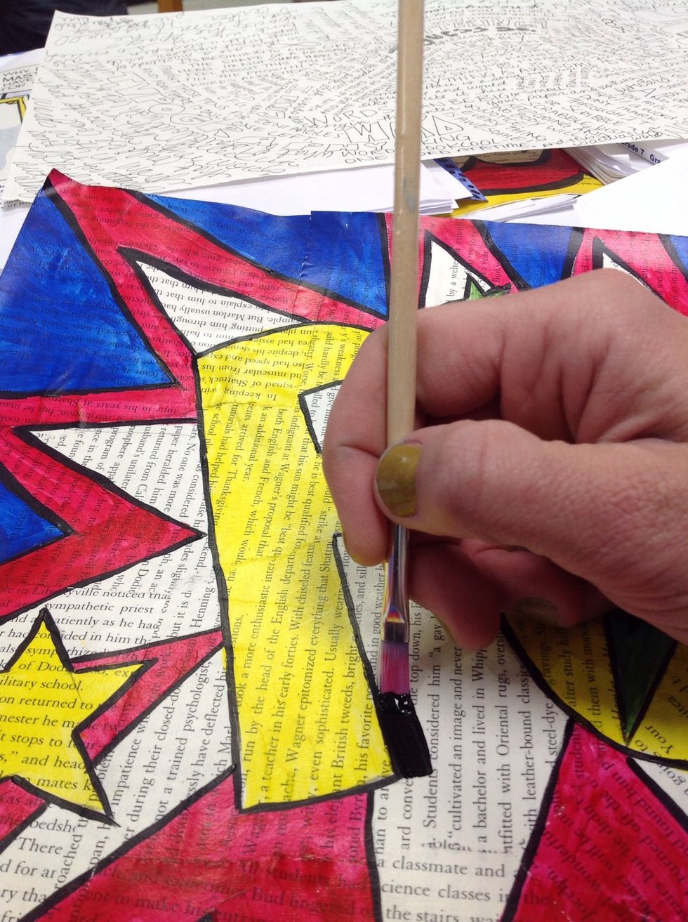 I'm using the flat head brush to add a thick black drop shadow to POW!