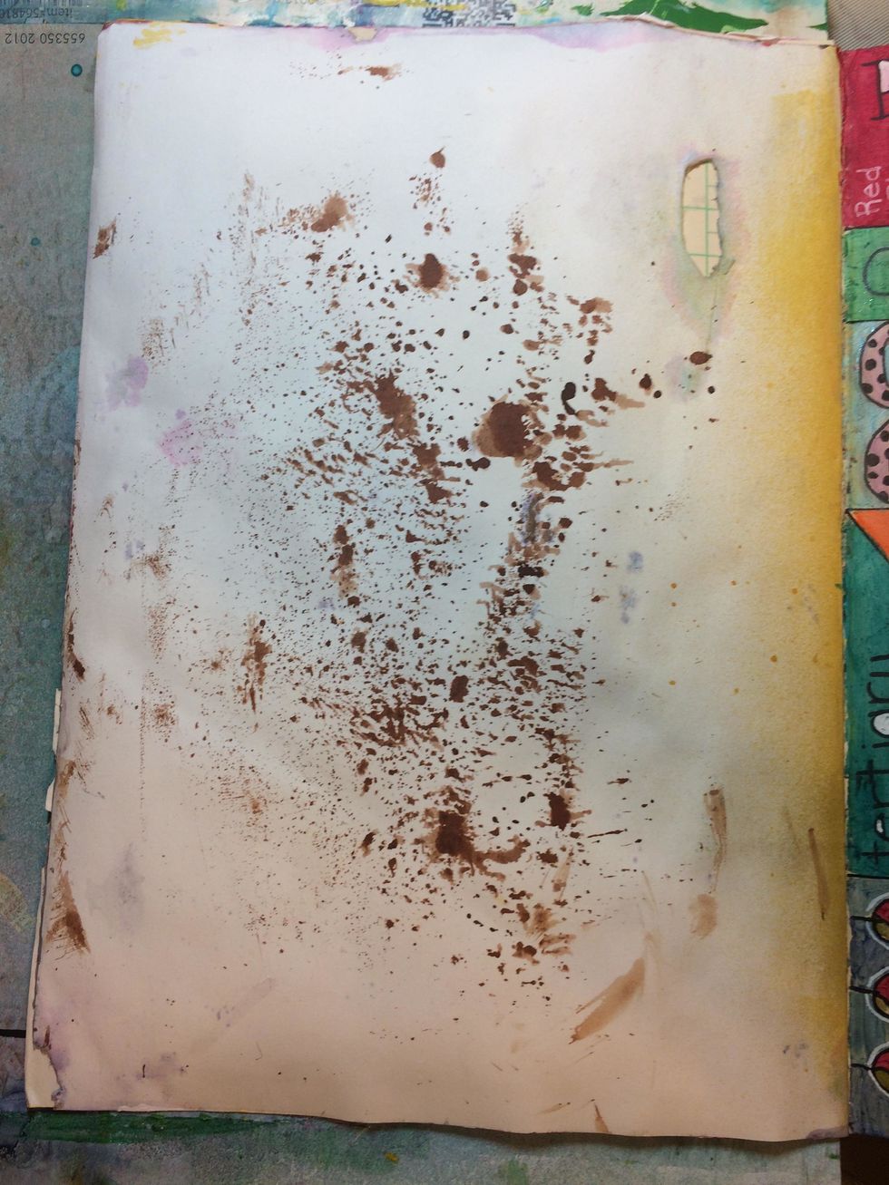 I'm working in my art journal today.  This is a page that has a hole in it an some excess spray from another project long ago.  lol  But!  I'm still going to use it.