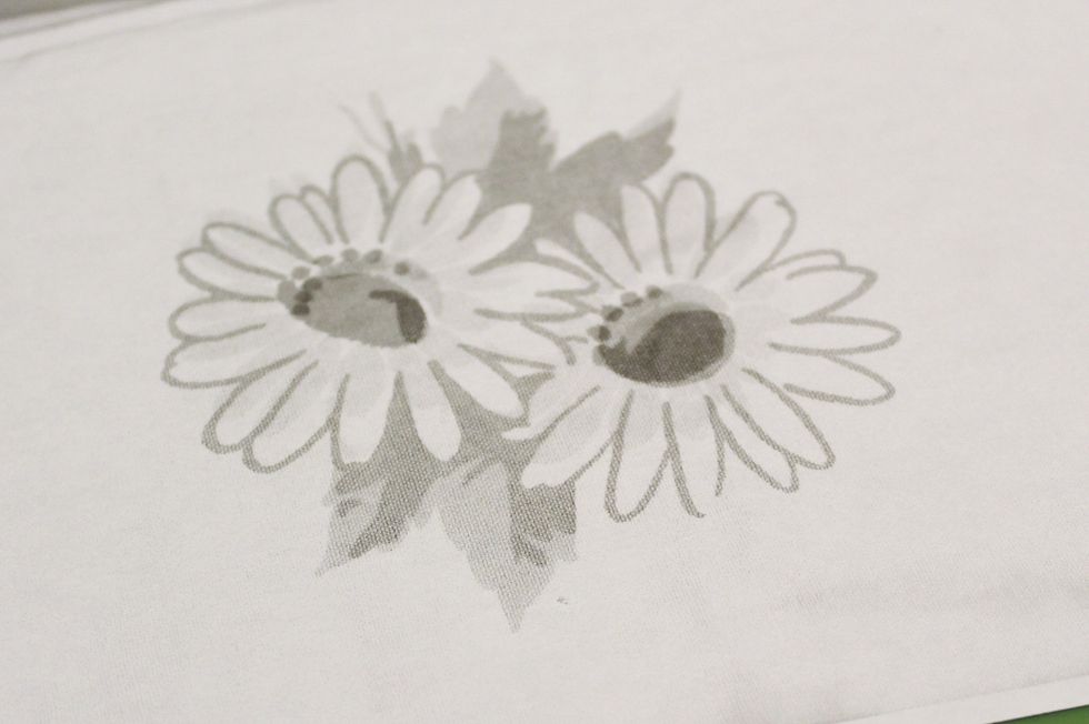 I made a black and white copy of the flowers; resizing them to fit on the cards...