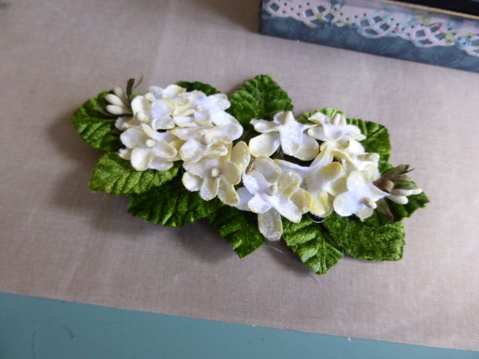 I made a flower arrangement by winding the wire stems on the leaves together