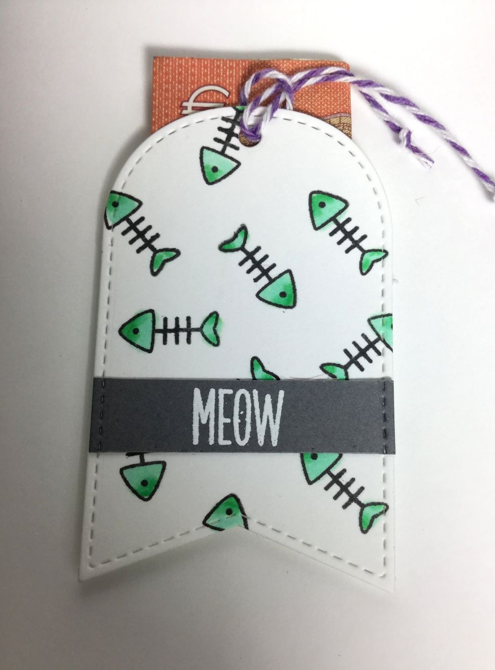 I made a little tag on the inside of the card so I could put some money behind it. The tag is attached to the card with 3D tape.