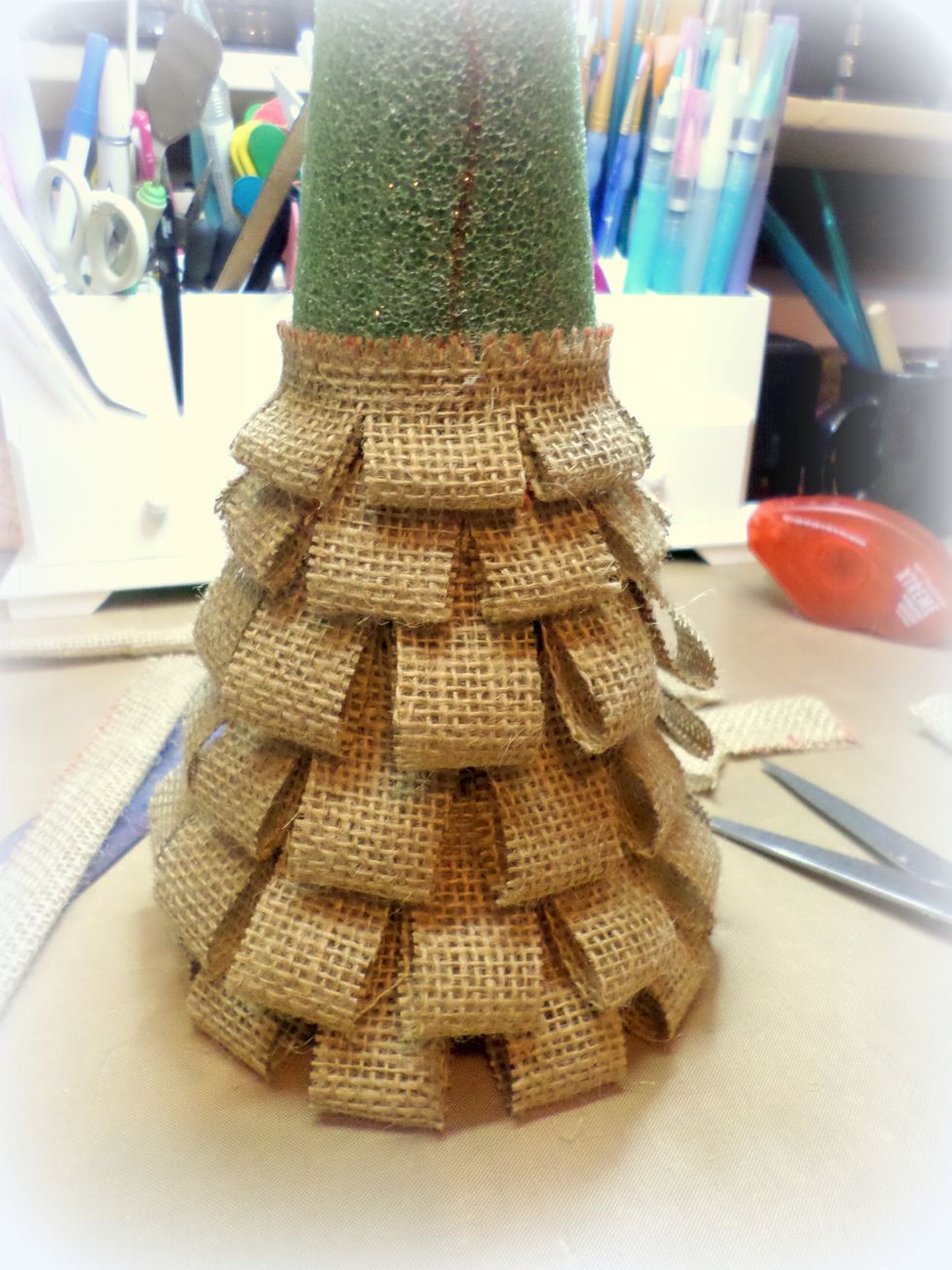 I made a red line on my tree so I would always know where the center was. Keep adding strips up the tree. As you can see, the smaller strips begin 4 rows up.