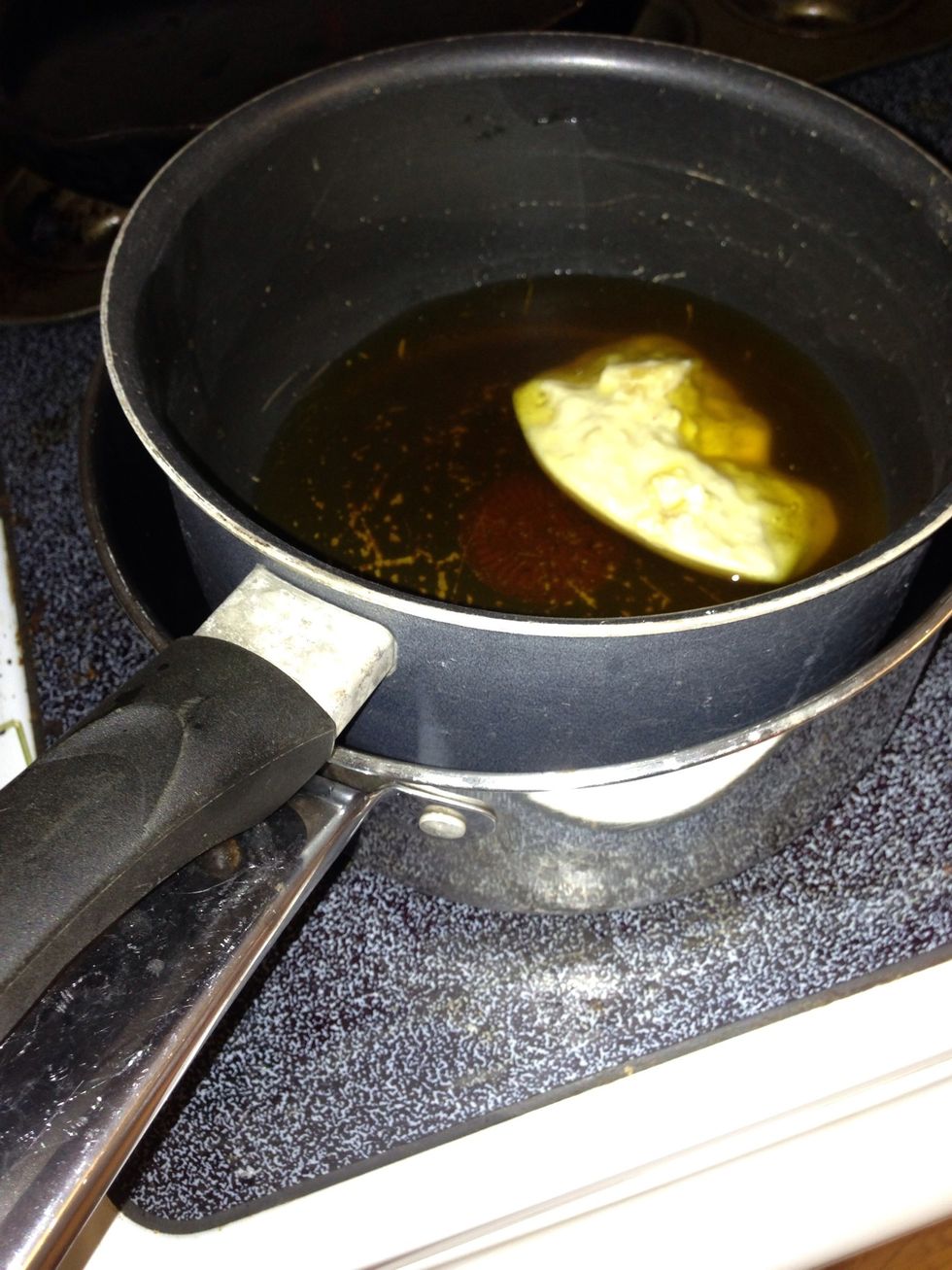 I made a simple double boiler by putting a larger pot half filled with water on the stove eye, then putting a smaller pot in it. Melt 12 ounces of beeswax. Place heat to medium and stir occasionally.