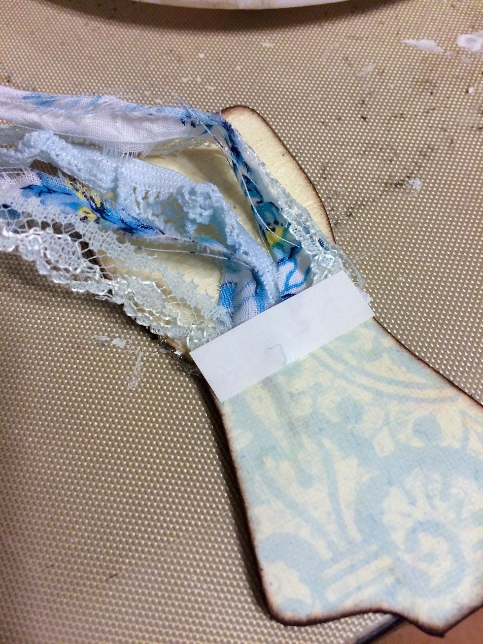 I made a skirt onto this dress form using strips of fabric and laced trim.