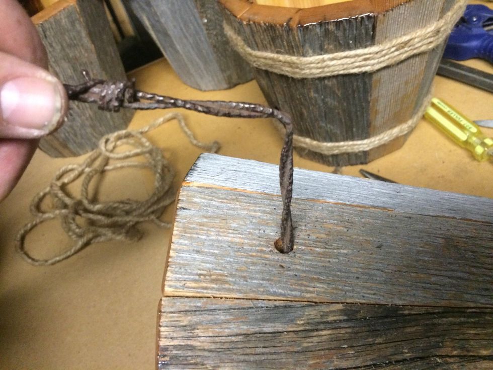 I make my bend in the barb wire with a set of pliers.