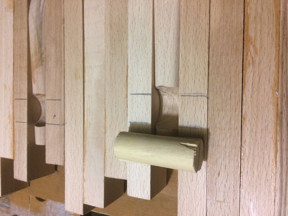 I marked out where I wanted the braces. I cut a dowel in half and used that as a brace.