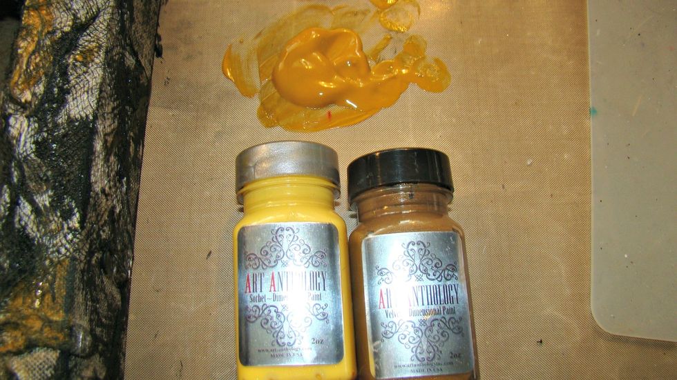 I mixed the following colors together to get a more muted gold color for the outside of the canvas. AA's Sorbet in Sunshine and AA's Velvet in Kona. Dry brush sections of the canvas with the paint.
