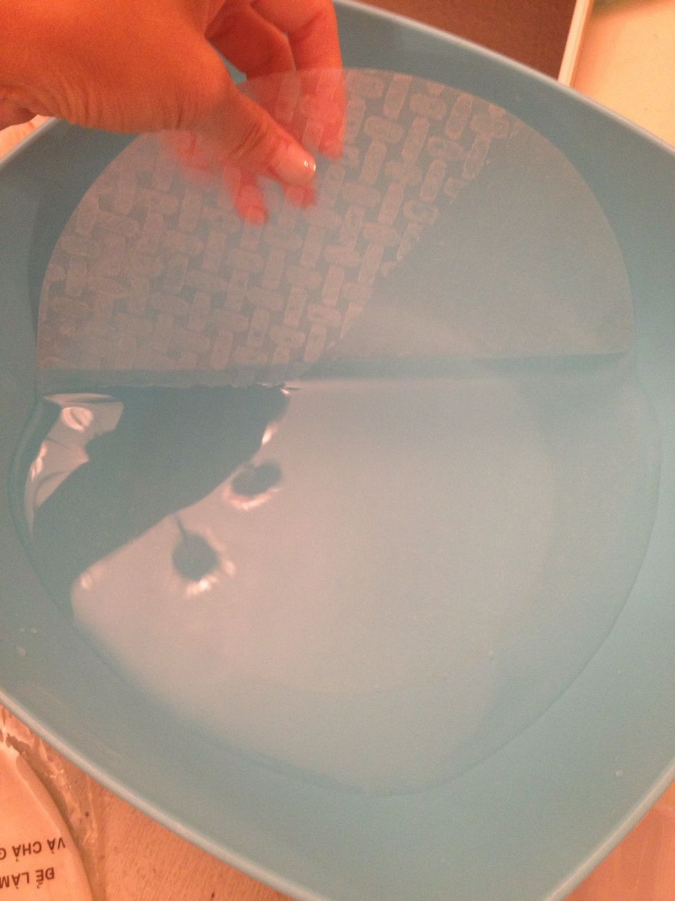 I move in a quick counter clockwise but you can do clockwise too. As long as you get that paper wet entirely, it doesn't matter how you do it. Some even use a spray bottle.