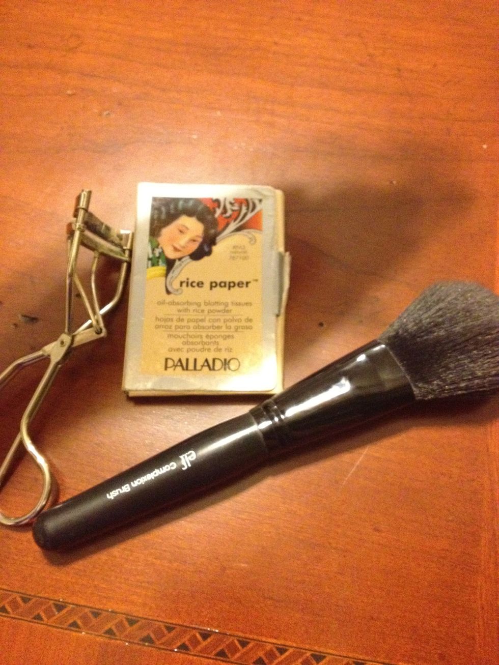 I only bring one, fluffy powder brush to use for multiple products to save space. I also keep the ever-trusty eyelash curler and oil blotting tissues with rice powder to control oiliness on hand.
