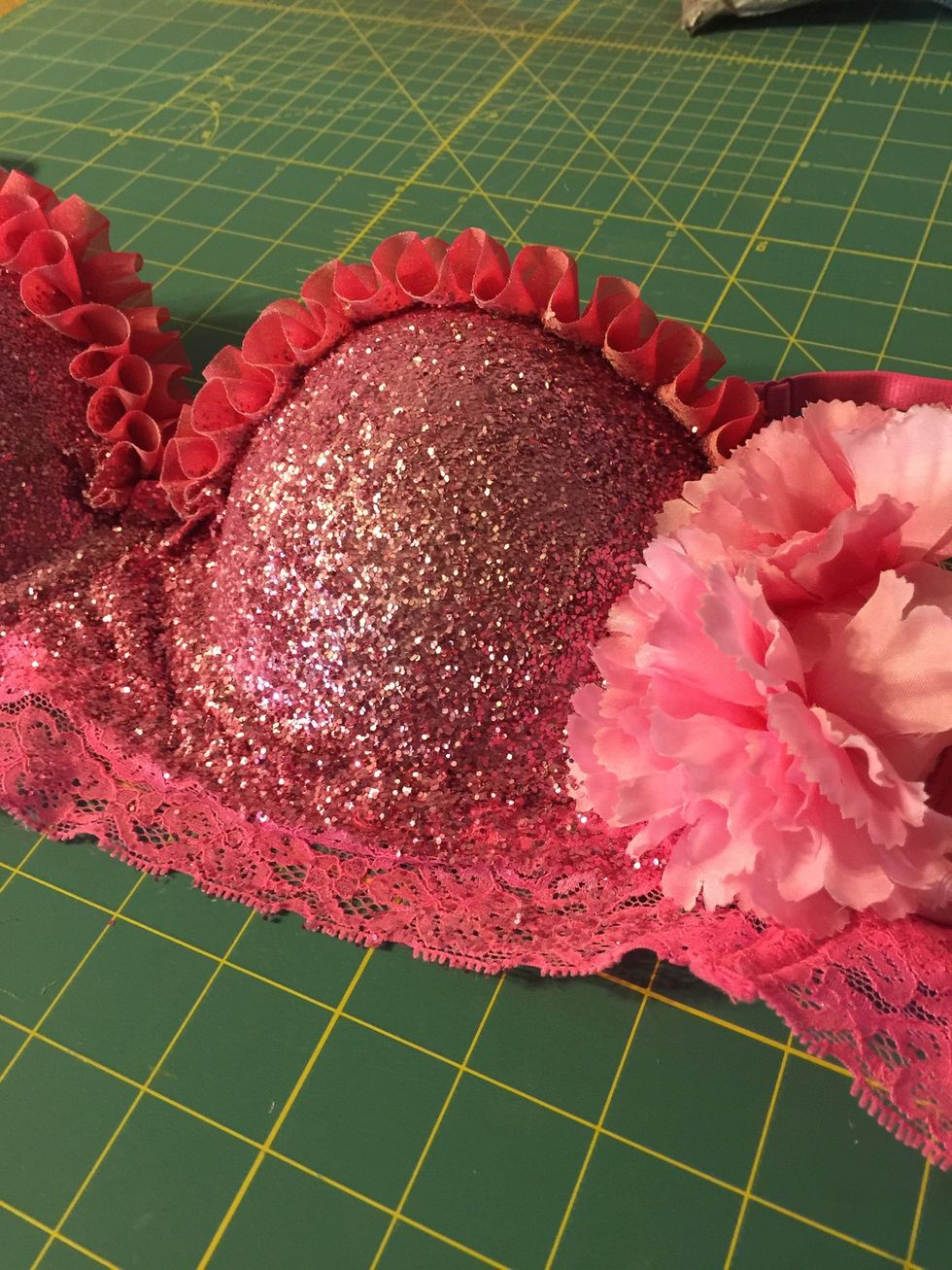 I opted to use spray adhesive to add glitter to the cups and grab some fake carnations to add a little girly touch.