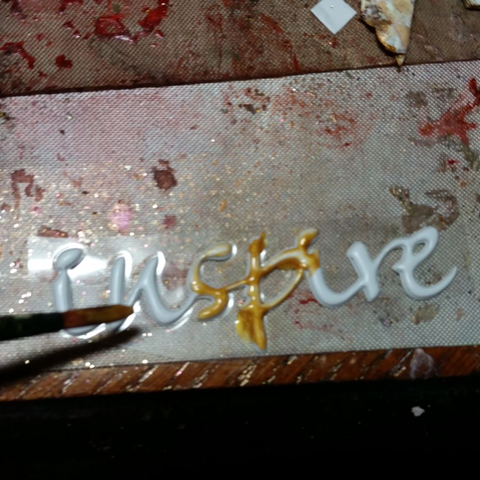 I painted the stickers with the TA gold paint to help them blend better.