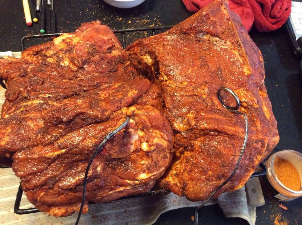 I place a thermometer probe inside the butt and connect it to the transmitter. The probes need to measure the temp in the center of the butt. This will determine if it has cooked through.