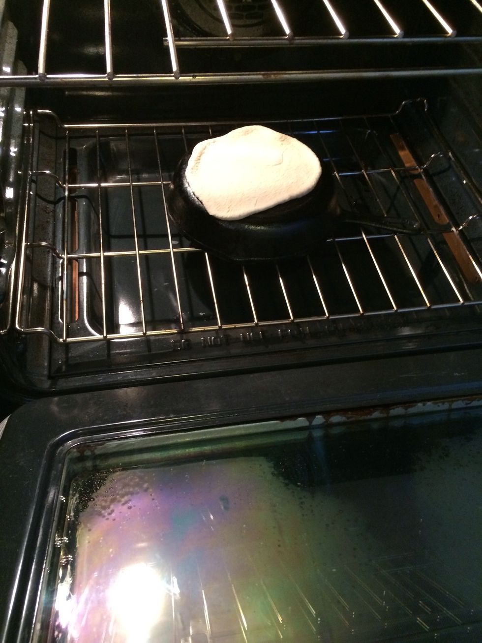 I place the rolled out dough right on top of the hot cast iron pan.