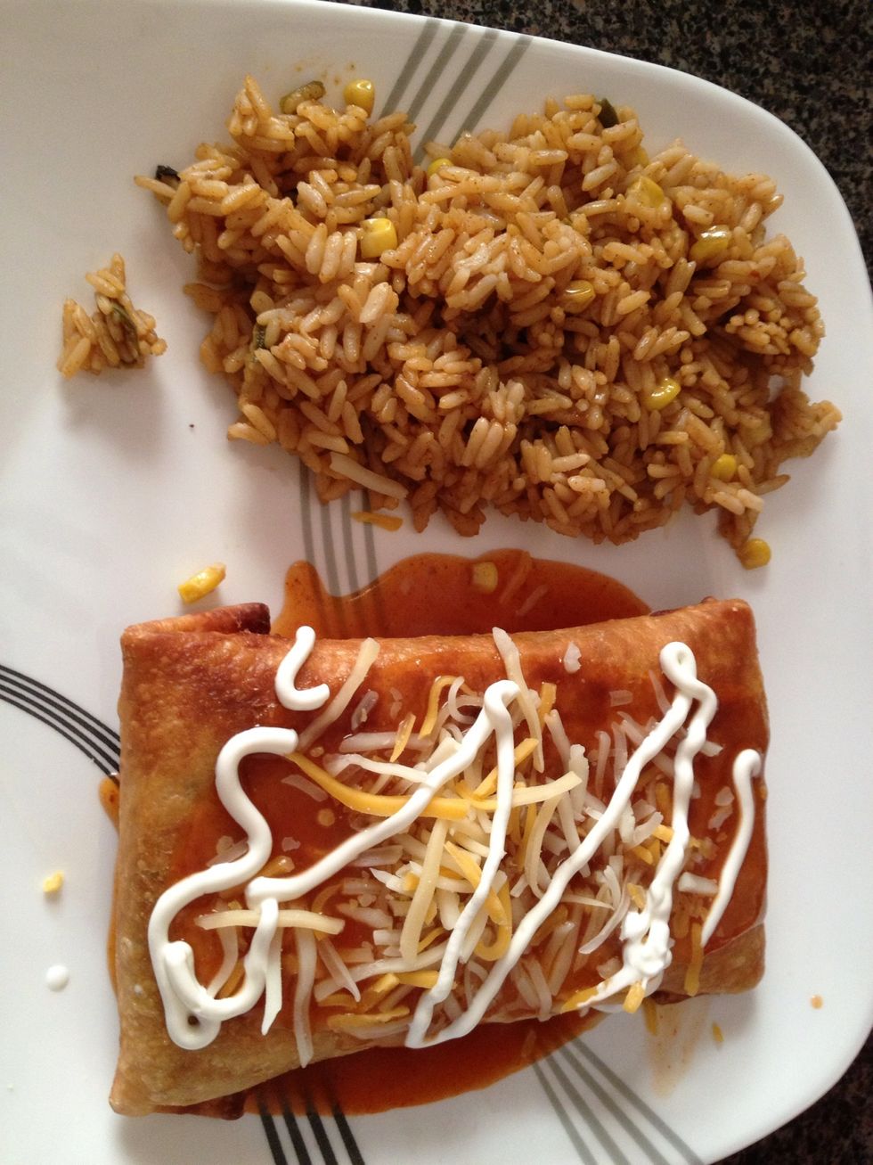 I placed enchilada sauce then chimichanga A bit more cheese and drizzled some sour cream yummy