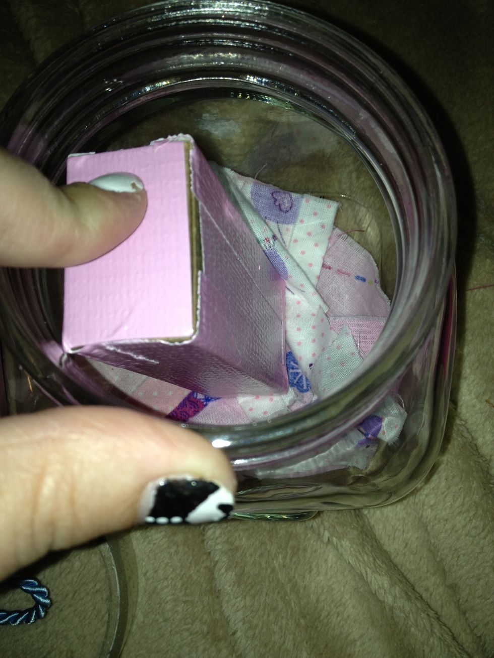 I placed some fabric in the bottom of the jar then placed the box inside