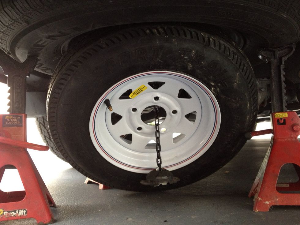 I positioned the spare so the chain would hang through it