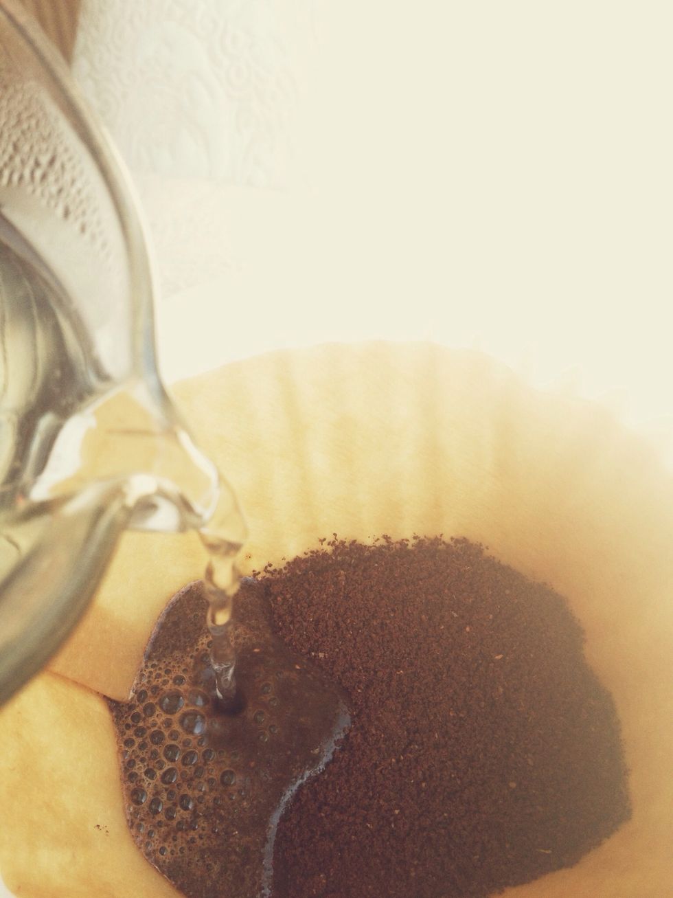 I pour very slowly over minutes to allow the water to saturate the coffee without flooding it. Once again- there is a refined process that involves a specific pour, but for everyone else- pour slow.