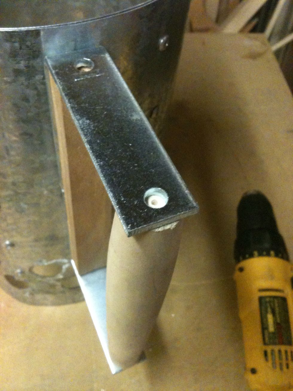 I predrilled the dowel, again so the wood won't split. Then I screwed the dowel to the brackets.