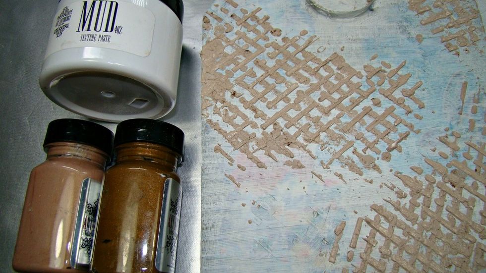 I prepped it my surface first with white gesso, then mixing the two browns to come up with the color I wanted, I mixed with Mudd. Stencil morse code and layered it criss-cross to resemble burlap.