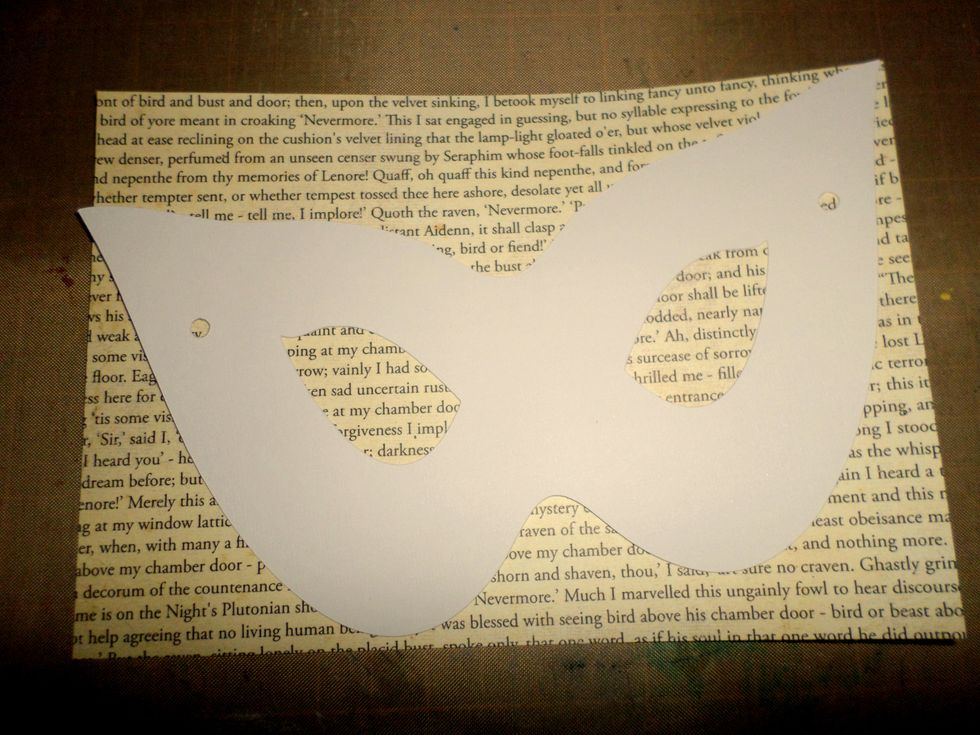 I printed out the poem on cardstock to layer on top of the mask. You can use any patterned paper you want. Trace the mask shape on the paper and cut it out.