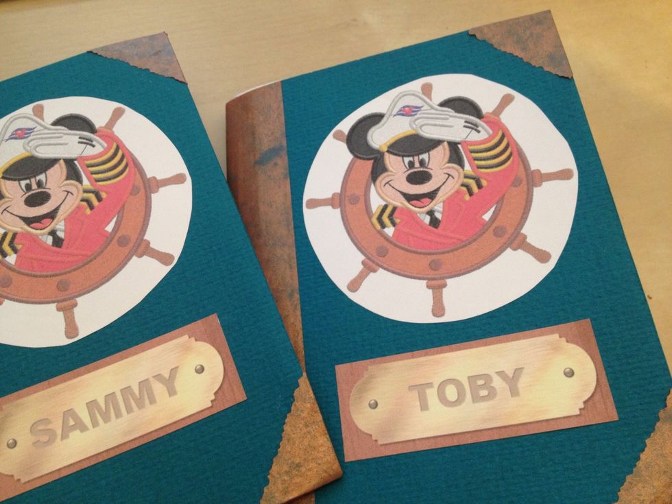 I pulled some images off Google image search for the cover, added my kids' names to a name plate image, printed them on adhesive back paper, cut them out and placed on the front cover.