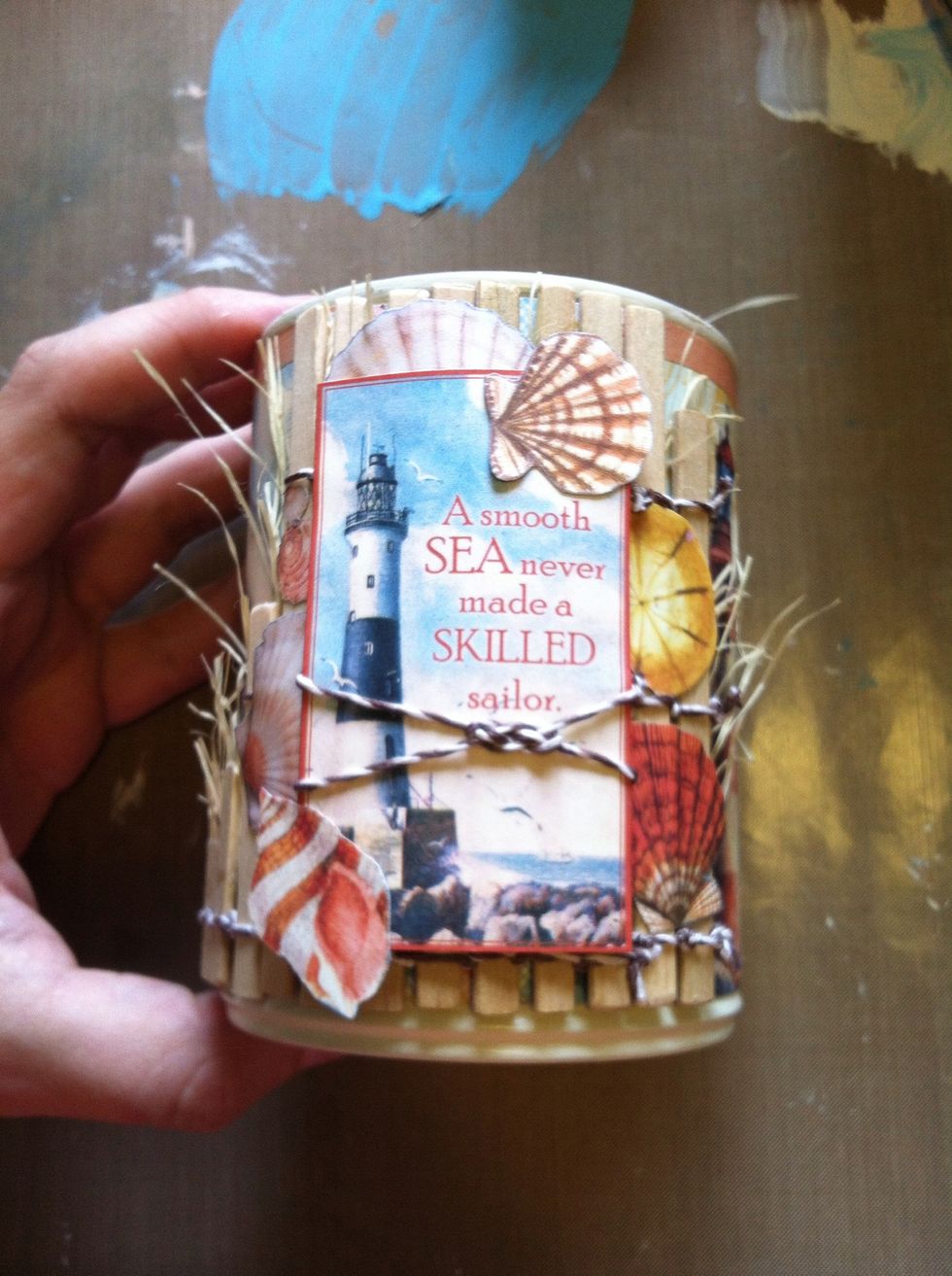 I pulled the backings off the popdots on the 'Sailor' phrase card we put together previously, and pressed it down on the fence area of the can.