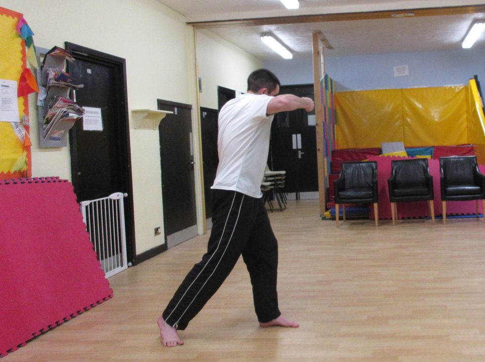 i punch across the side of the target. As I connect, I shift my centre of gravity into the punch increasing the power. I do this by rooting my weight on the front foot. This also increases stability.