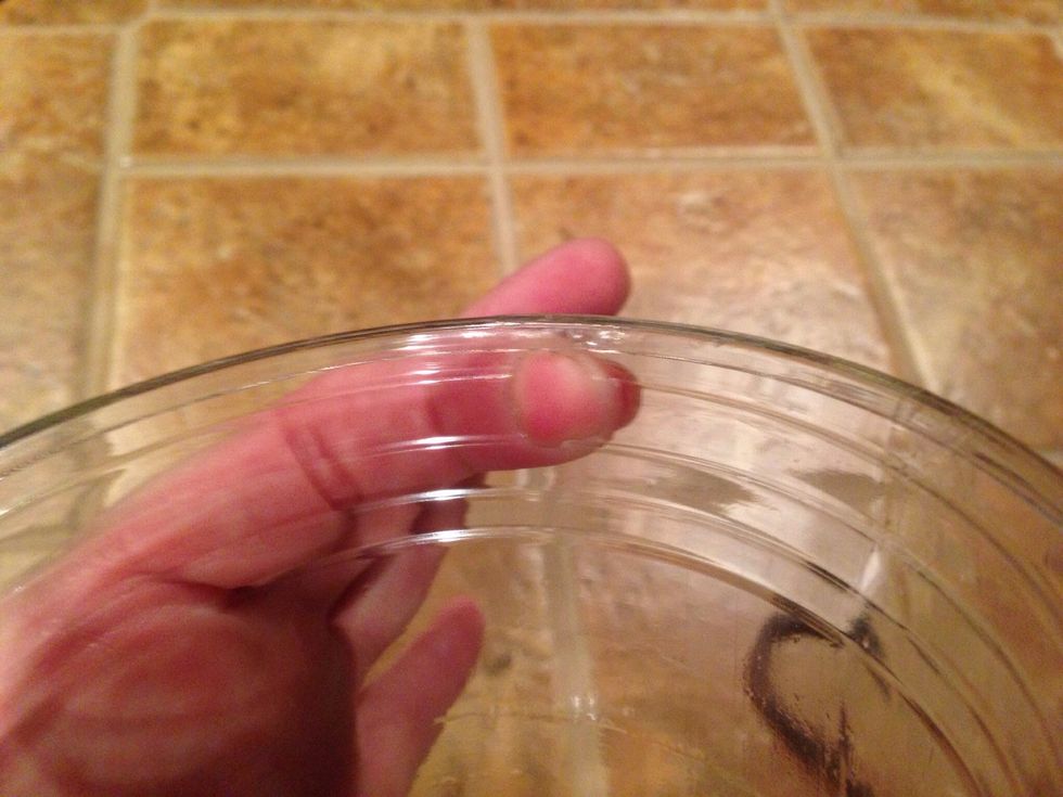 I punched 4 holes close together to get the size of hole roomy enough to easily move the cup on and off the hook.