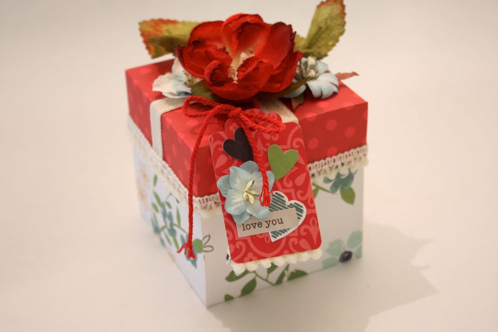 I punched out this little tag with a Fiskars punch, then added some Simple Stories Homespun Stickers and Die Cuts and tied it on with a little bow