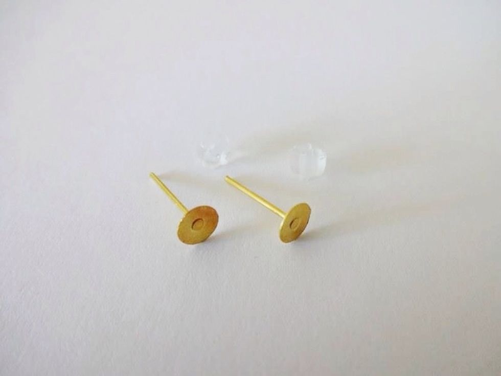 I purchased these earring posts off EBay. They're very inexpensive. I think it was about $3 for 100 posts. (That's 50 pairs of earrings!!!) the rubber bits to hold the posts in place are included.