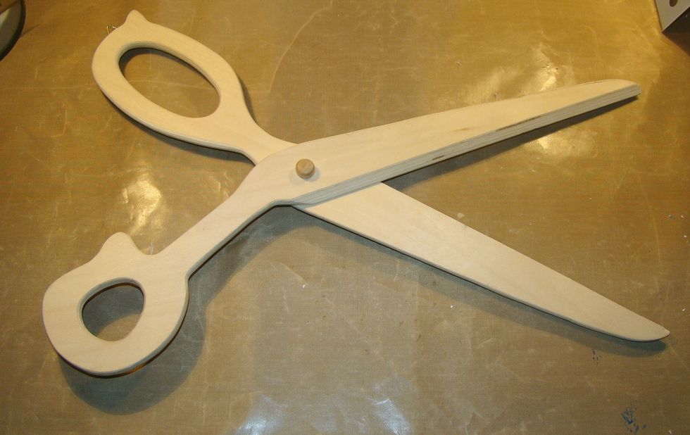 I purchased these wooden scissors at my local craft shop for $4.99 with a 40% coupon. I thought they would be perfect for my wall in my craftroom, so let's get started altering them.