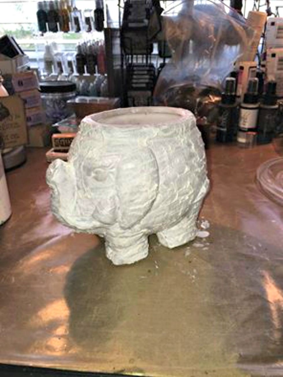 I purchased this elephant at a thrift store for $1.00 and knew that I wanted to "boho" him up... First gave him a rough coat of gesso. Using a sponge created the texture.