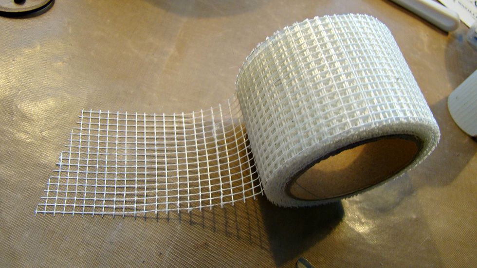 I purchased this mesh tape at the 1.00 store, just cut in pieces and add to your tin in random spots.