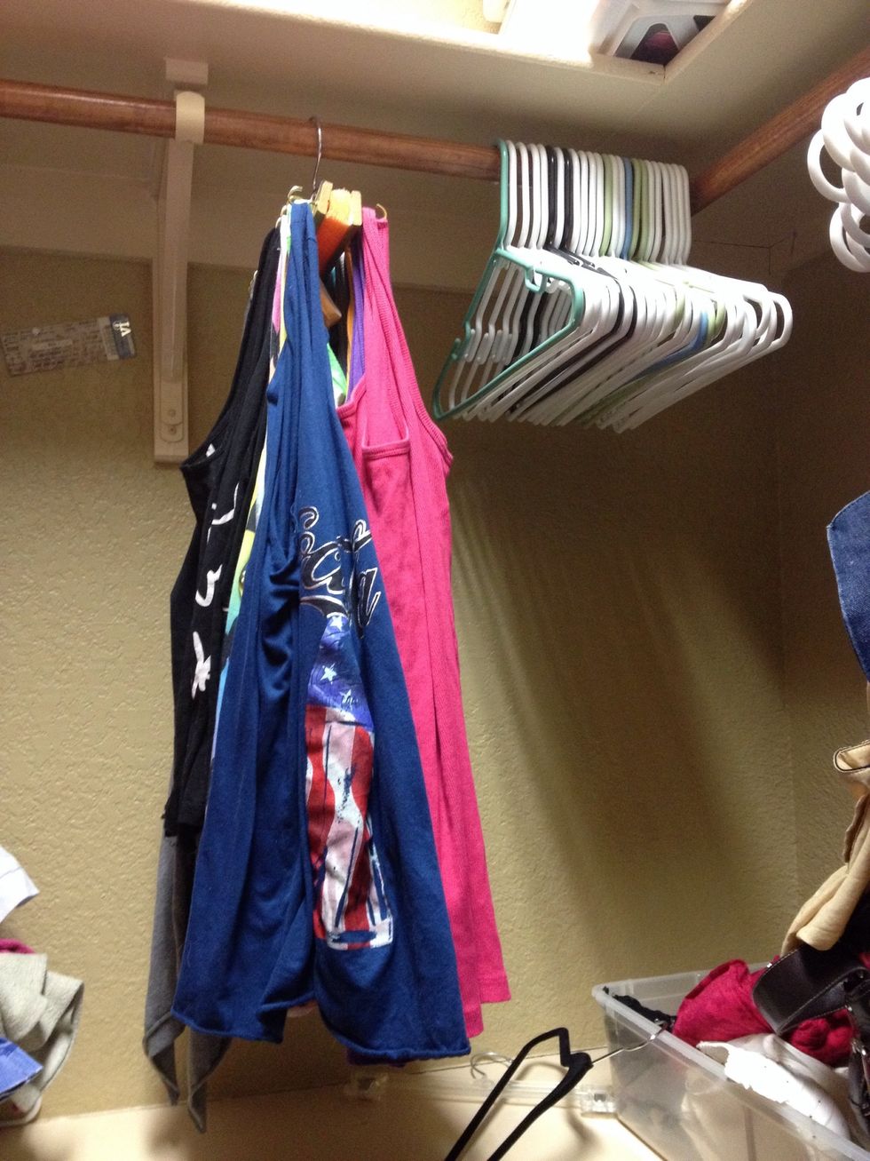 I put 12 hooks on each side which allowed me to hang 24 tank tops in the space of about 4 hangers.  If your tanks are thicker, you could use bigger hooks and space them farther apart.