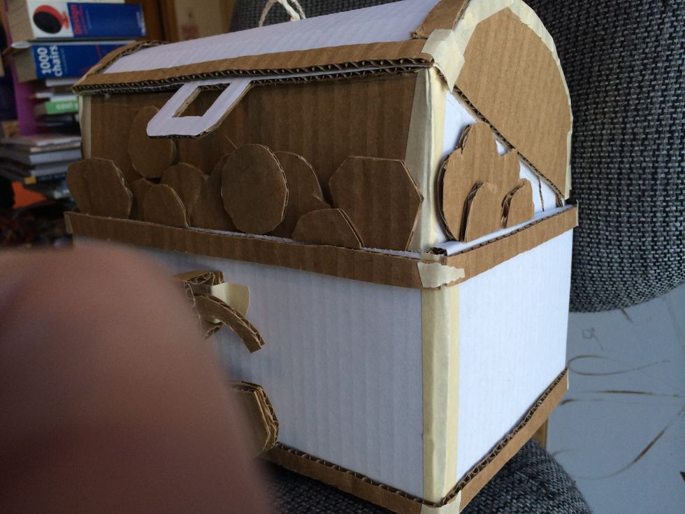 I put a little tape on the corners to hold the strips while the glue dried, as some wanted to pop off...especially the ones on the rounded part of the lid. Let the glue dry thoroughly.