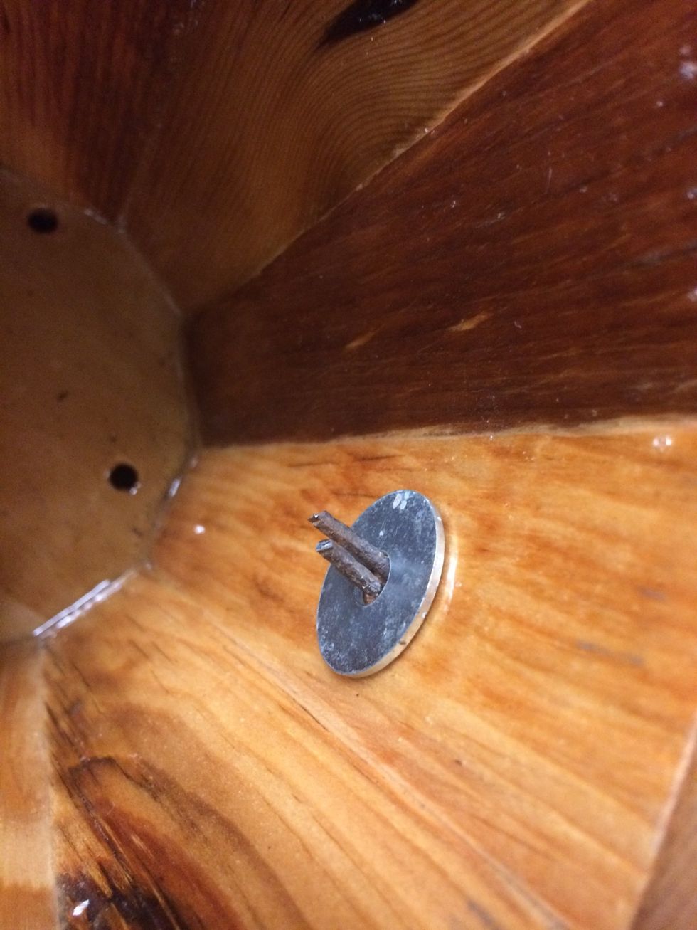 I put a washer on the inside of the bucket to help protect the finish from getting scratched. The washer is 1" wide and the hole is 1/4". I cut the wire down to about 3/4"-1" and bend it.