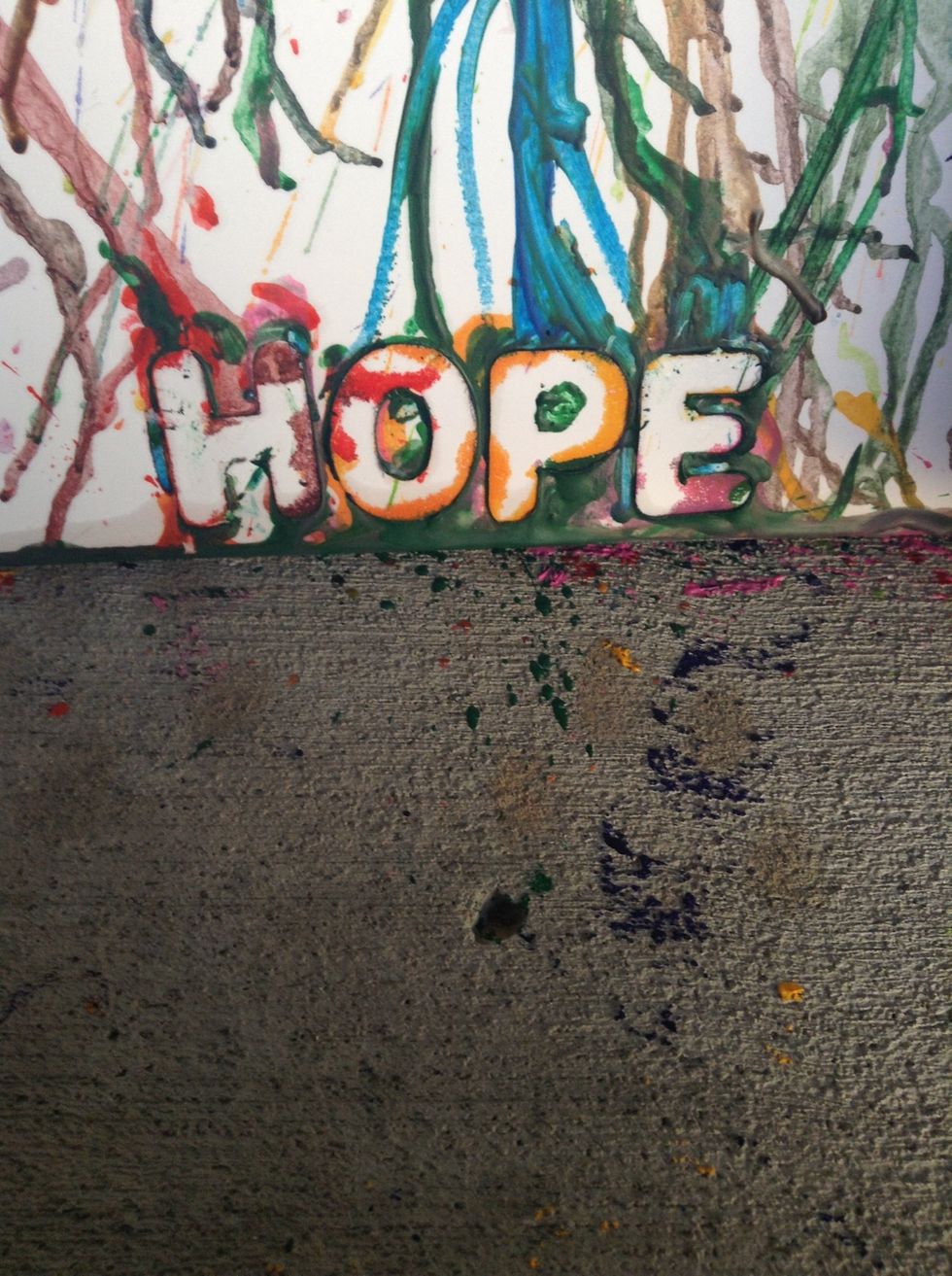 I put stickers on the bottom and when I took them off this what the outcome. You can put any word, character, phrase, or sentence as long as you cover up the area before you start to melt the crayons.