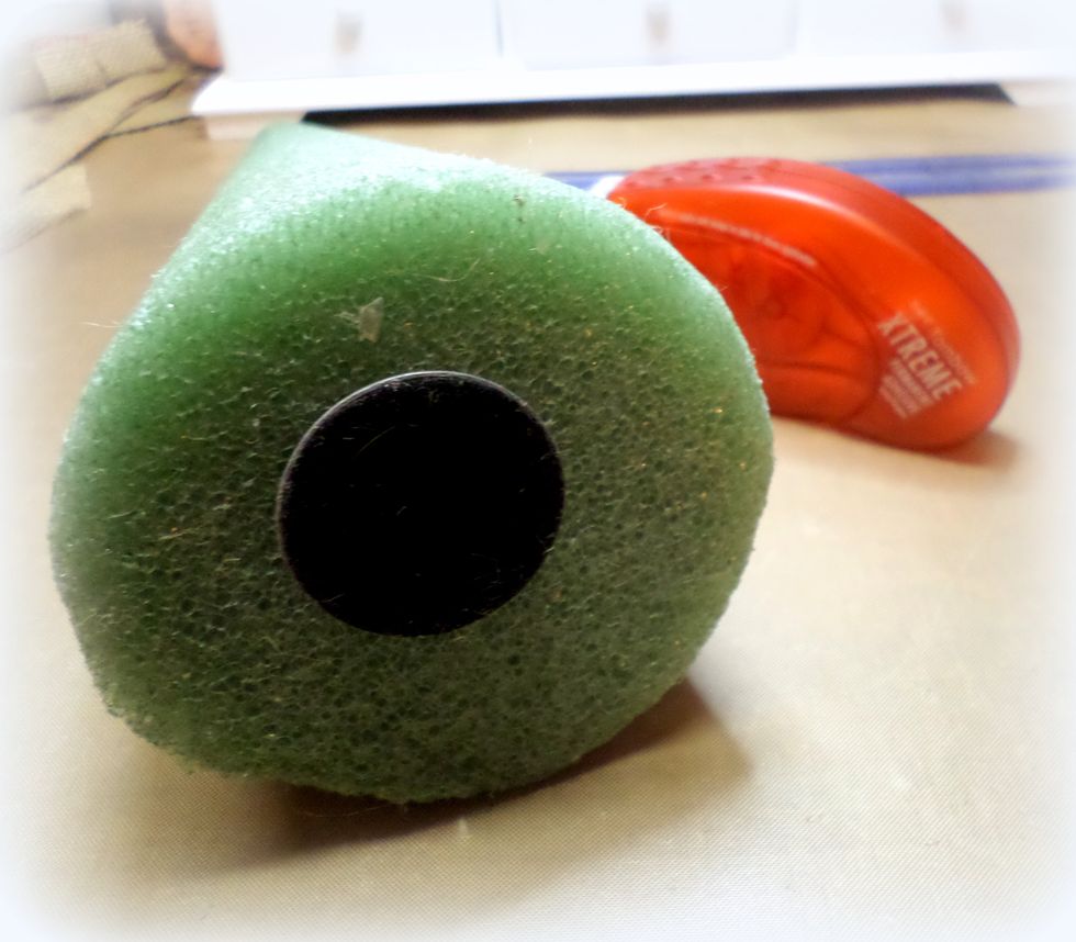 I put the "frog" in the center of the tree. You don't have to do this, your tree will be fine without this because the layers of burlap will give the tree enough weight.