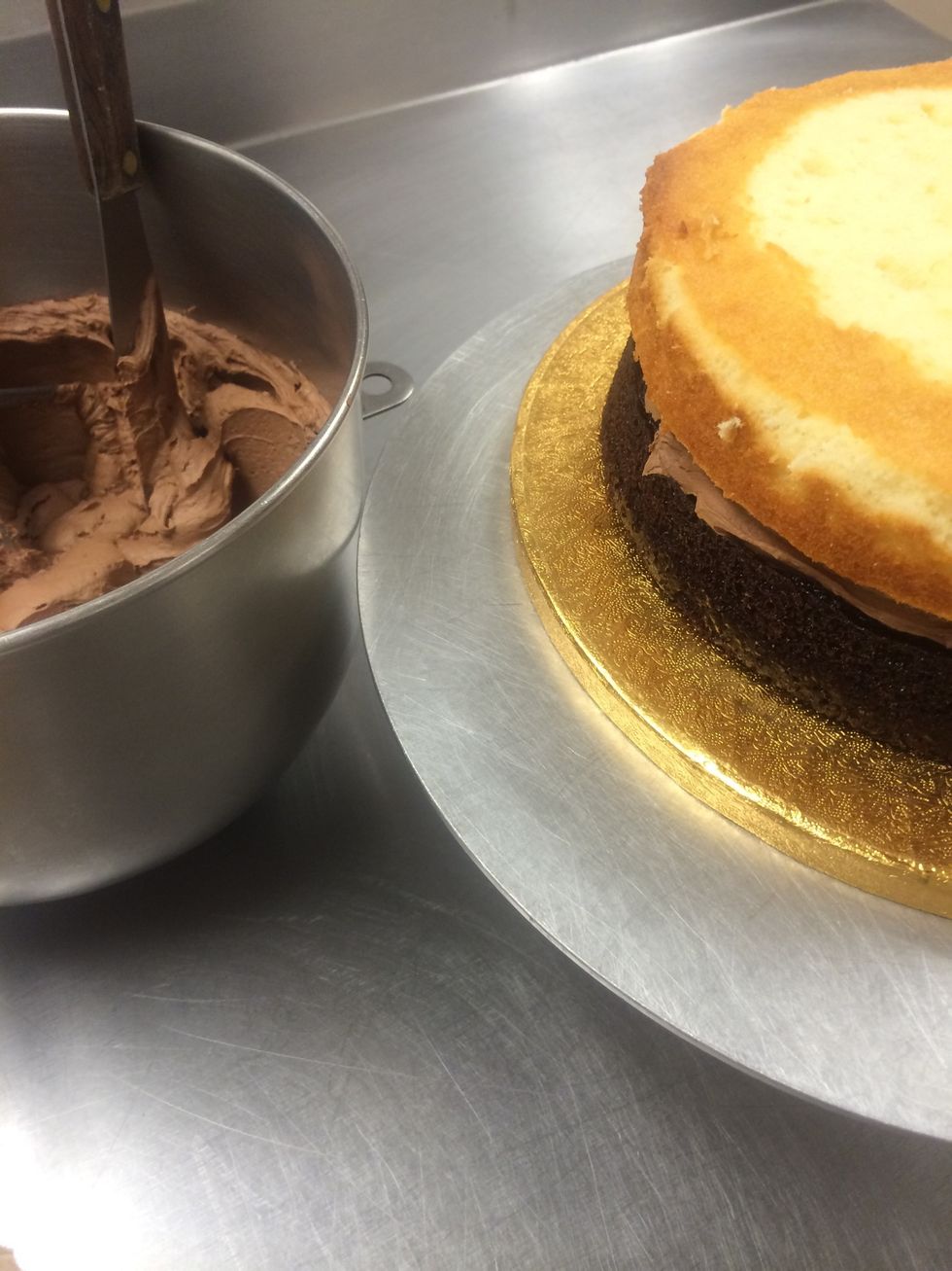 I put the second layer of cake on top, cut side up.