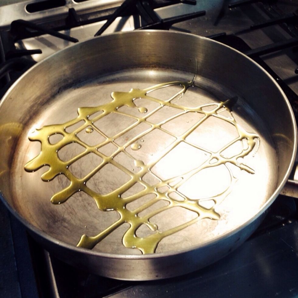 I put the stove on medium heat and add a little olive oil.  Why?  Because my husband buys the super lean ground beef and we all know where the flavor is at.