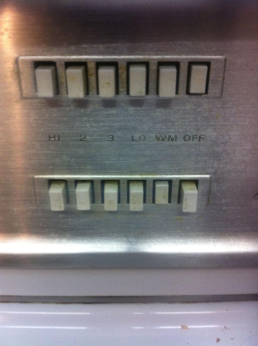 I put the stove on WARM and prepare the hotdogs.