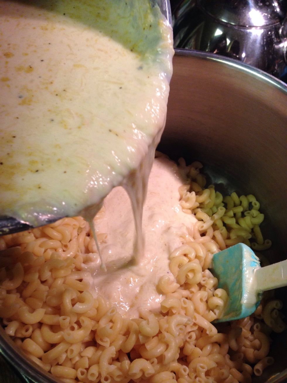I put undercooked macaroni back in large pot then pour in cheese sauce.