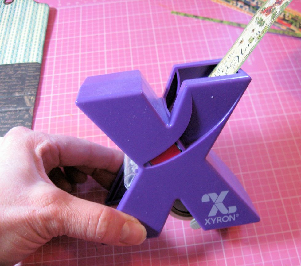 I ran mine through my Xyron 1" sticker maker.