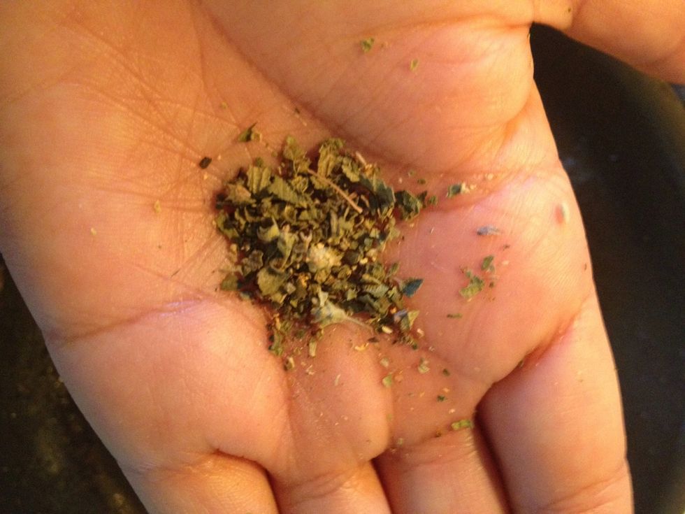 I read that crushing oregano in your palm releases essential oils & flavors. So crush up 1/2 tbs oregano and dust over onion & zucchini mix. Stir it up!