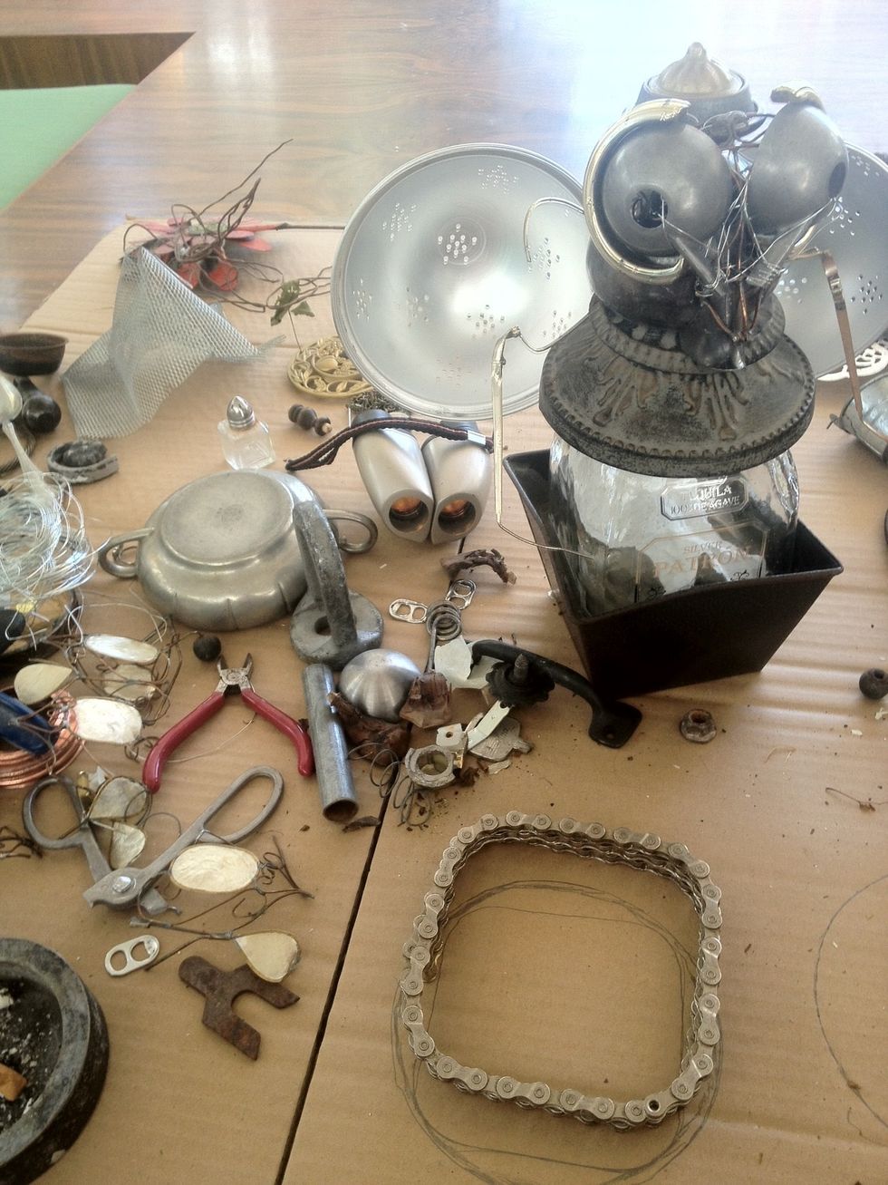 I really loved the arms but I was going for a "clean" look. When I started using all the smaller pieces the arms just sort of made it a little busy. Also the Patron Bee logo does not have arms :-)